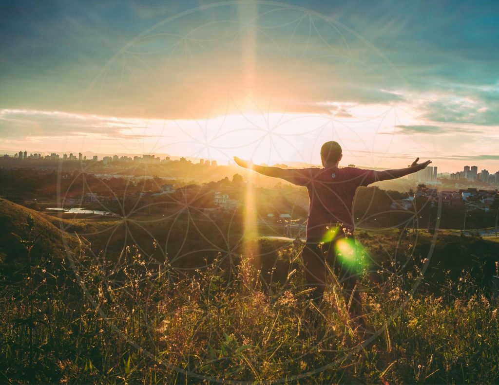 Man looking at sunrise reiki pranic healing talu regenesis
